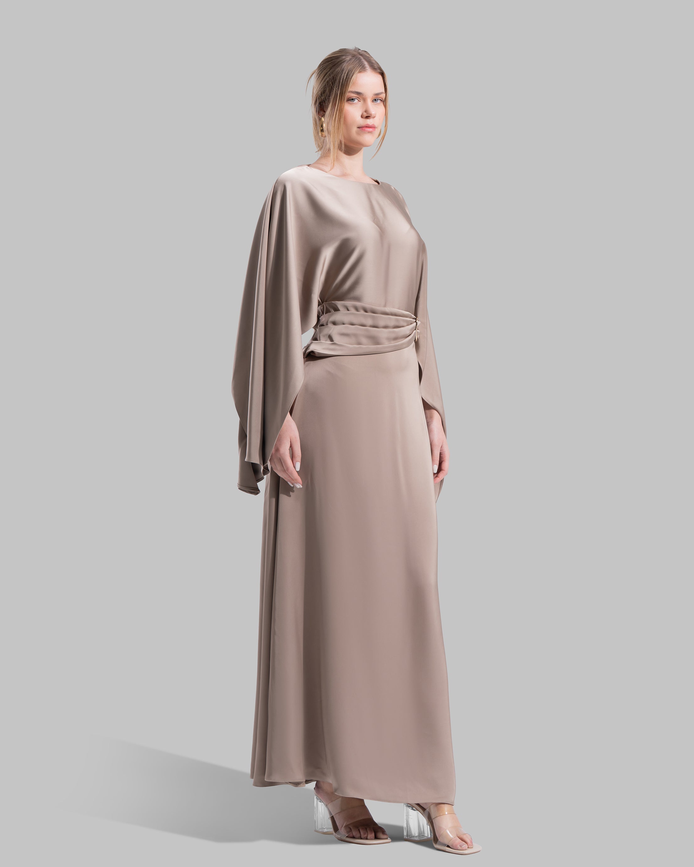 An elegant satin gown of sweeping length