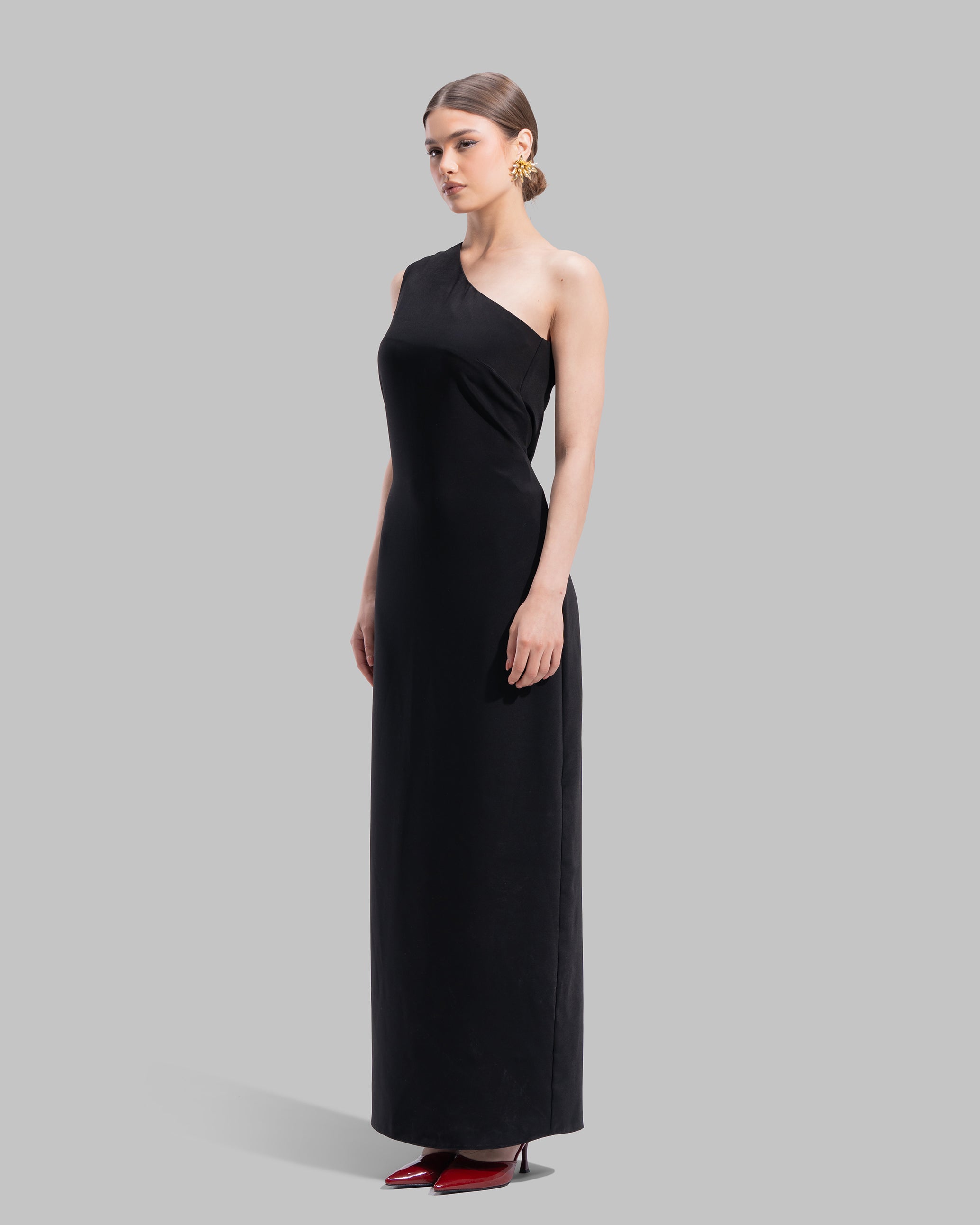 Draped asymmetrical neckline satin maxi dress with a fluid oversized silhouette.