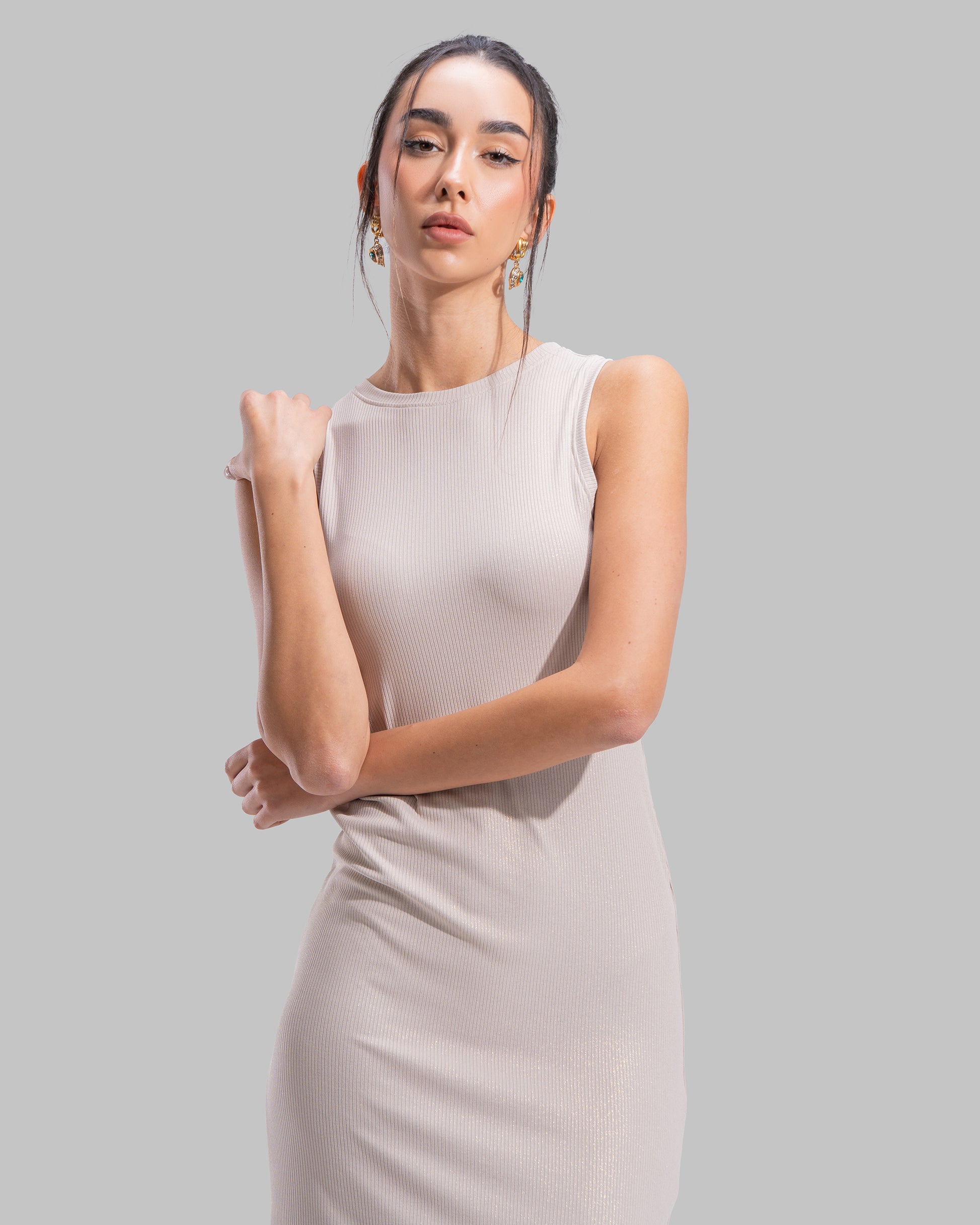 Sleeveless ribbed maxi dress with a round neckline and a tight-fit silhouette.