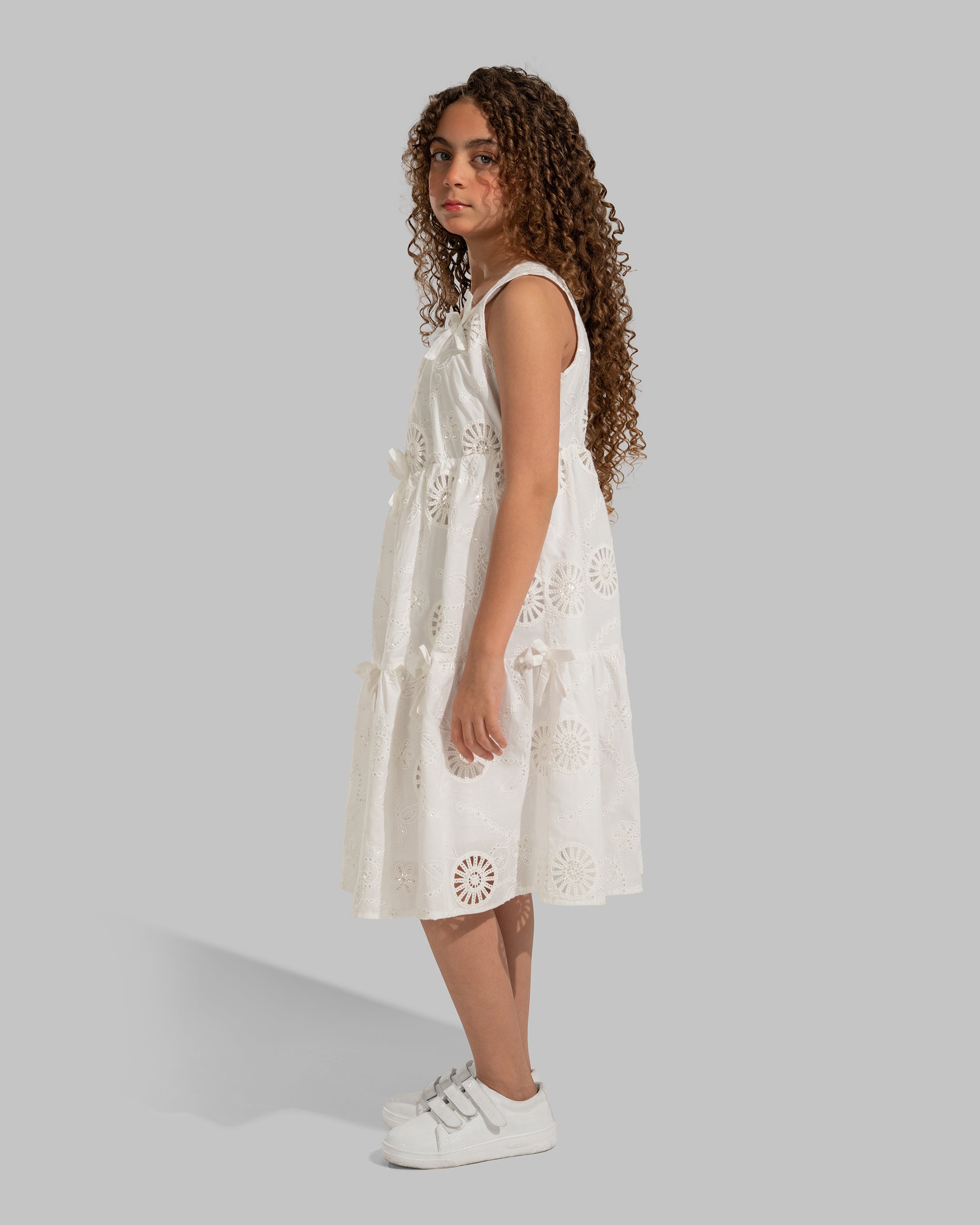 White eyelet midi dress with delicate bow details
