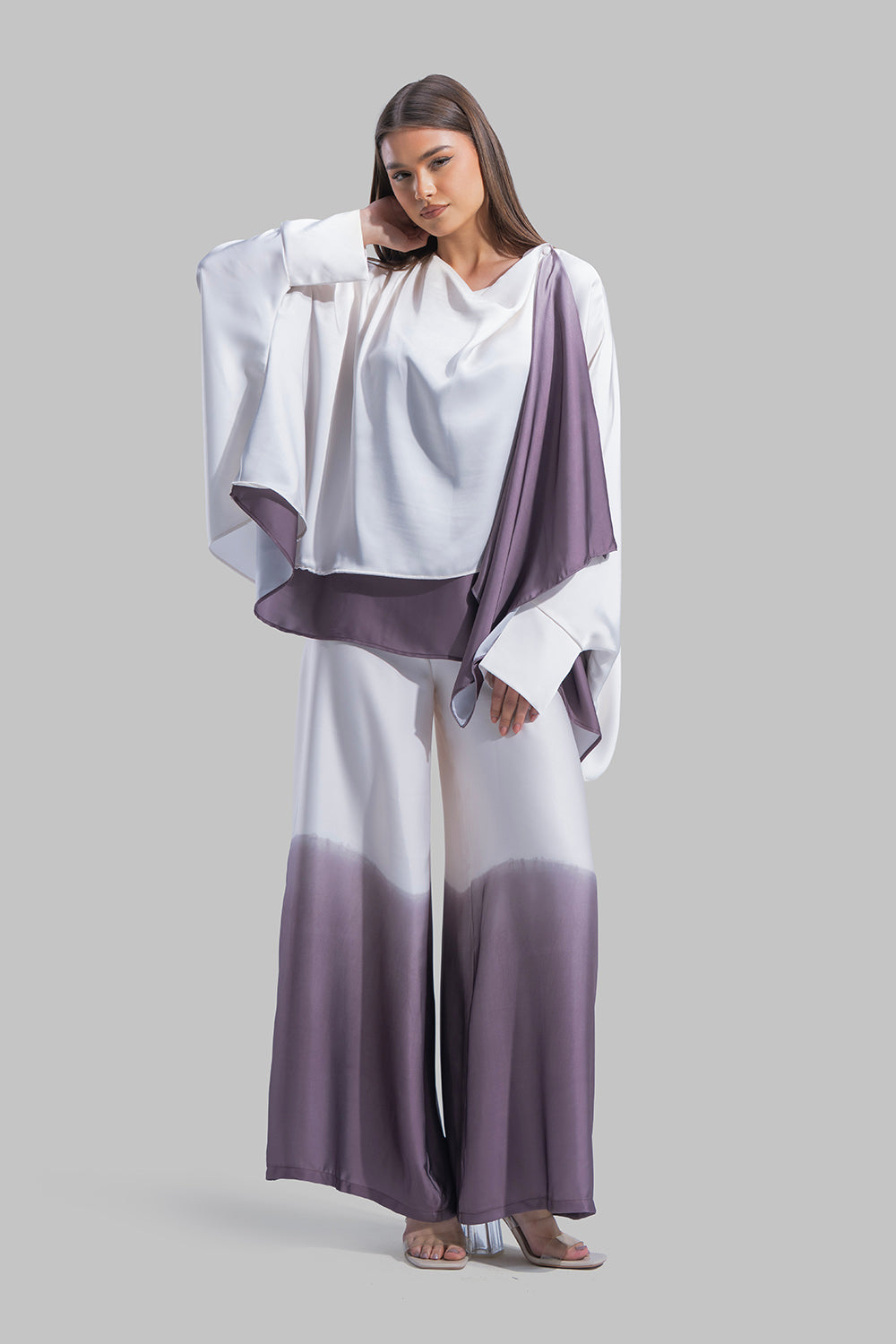 Draped asymmetrical blouse with a side-split design.