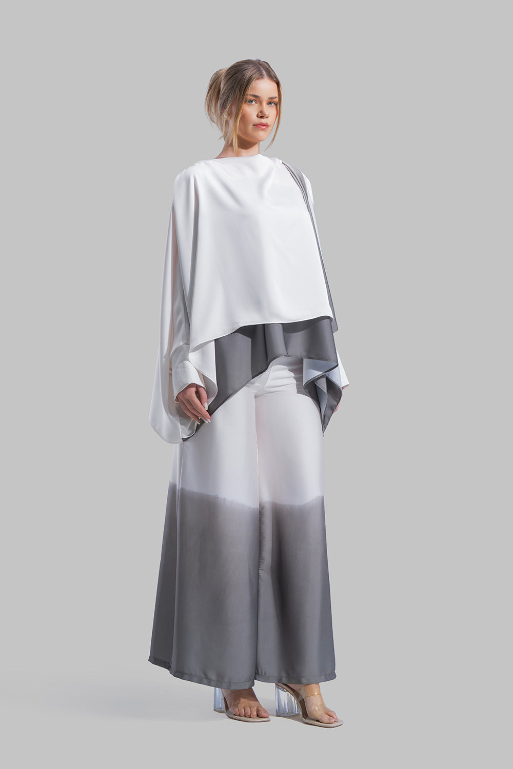 Draped asymmetrical blouse with a side-split design.