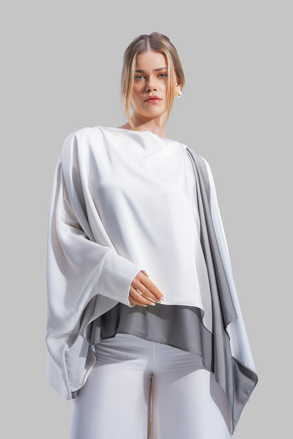 Draped asymmetrical blouse with a side-split design.