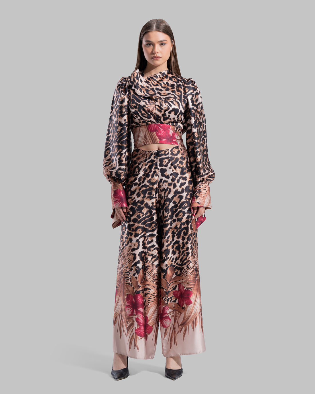 Long sleeve top with a draped neckline and slightly puffed shoulders.