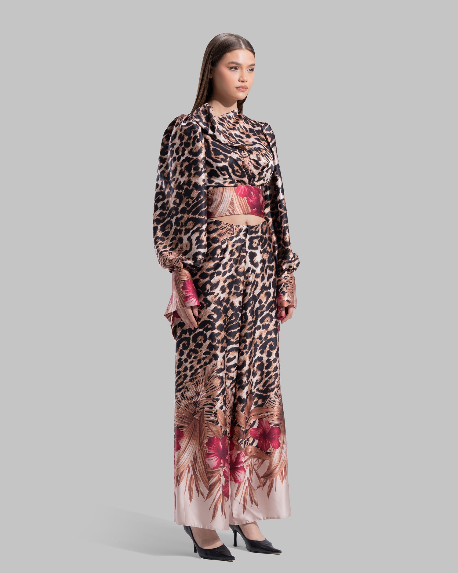 Long sleeve top with a draped neckline and slightly puffed shoulders.