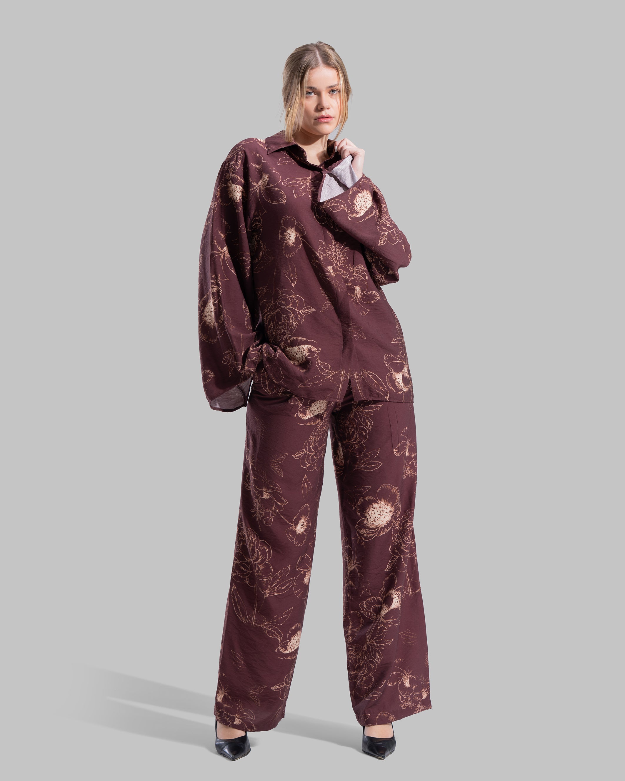 Oversized floral print blouse with a classic collar and long sleeves.