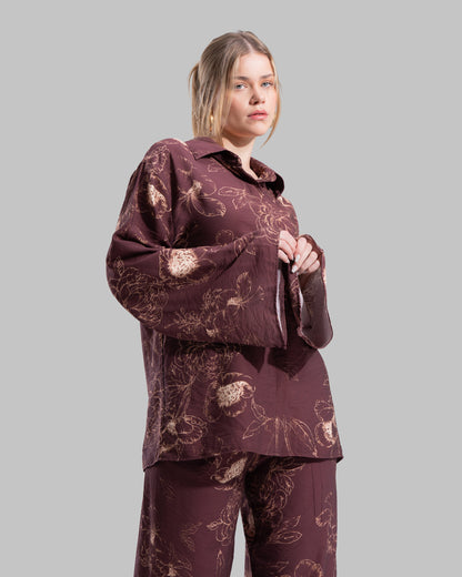 Oversized floral print blouse with a classic collar and long sleeves.