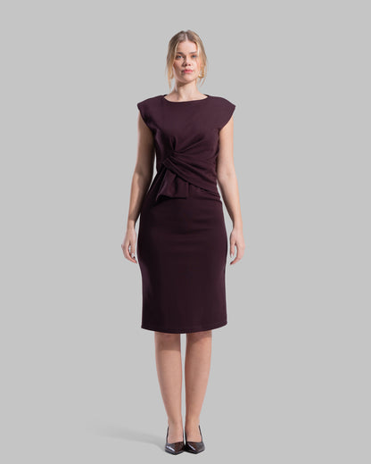 Sleeveless midi dress featuring a round neckline and front draped knot detail.