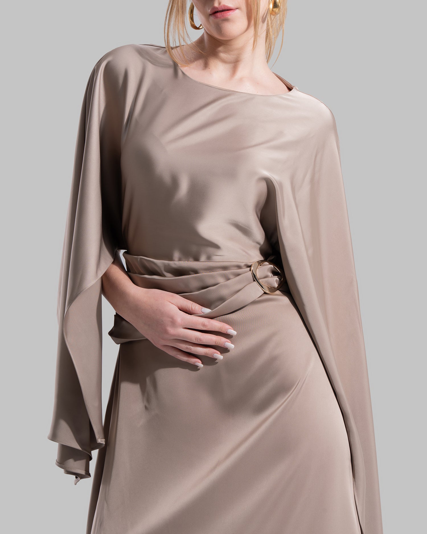 An elegant satin gown of sweeping length