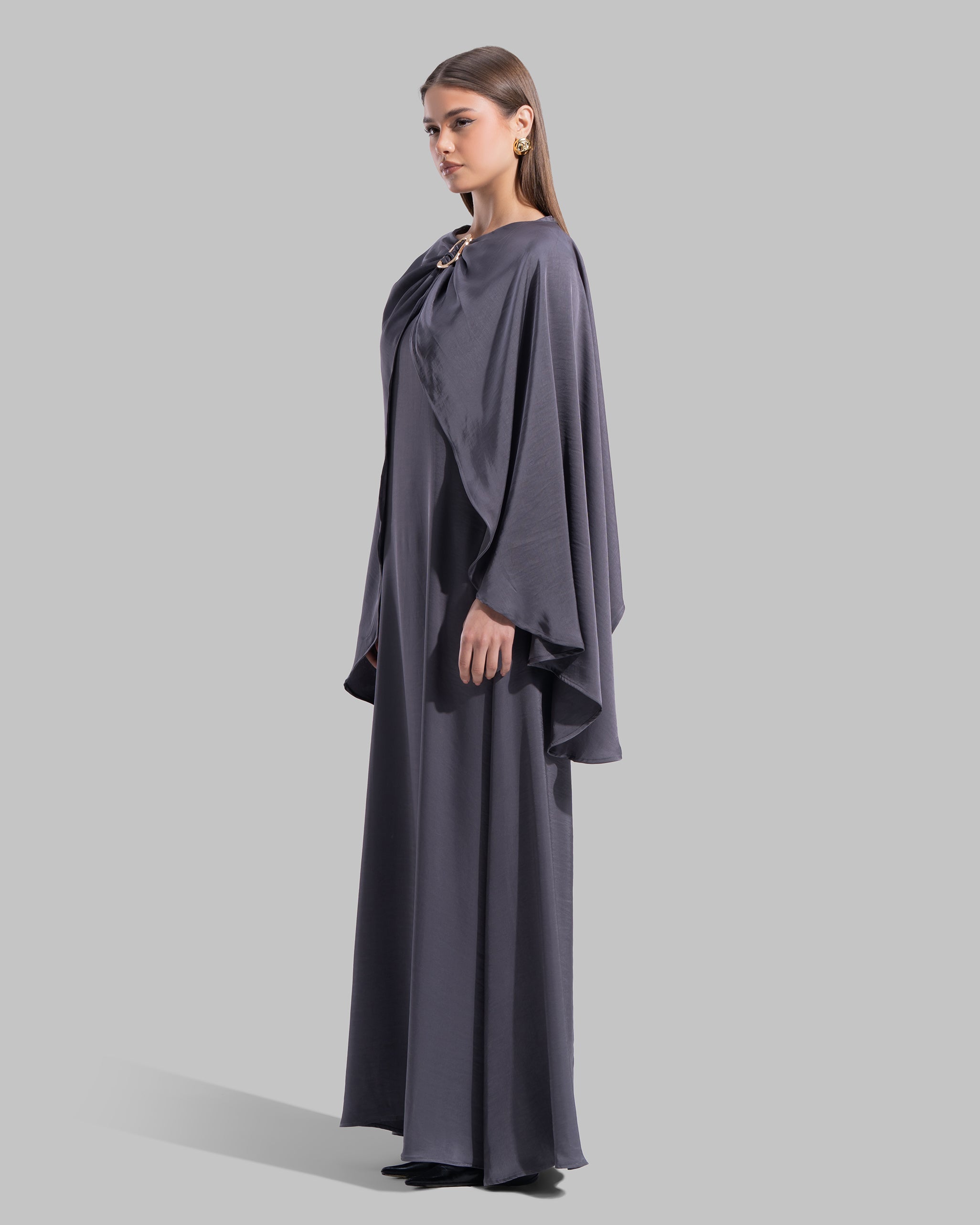 Long dress made of a flowing satin-finish fabric.