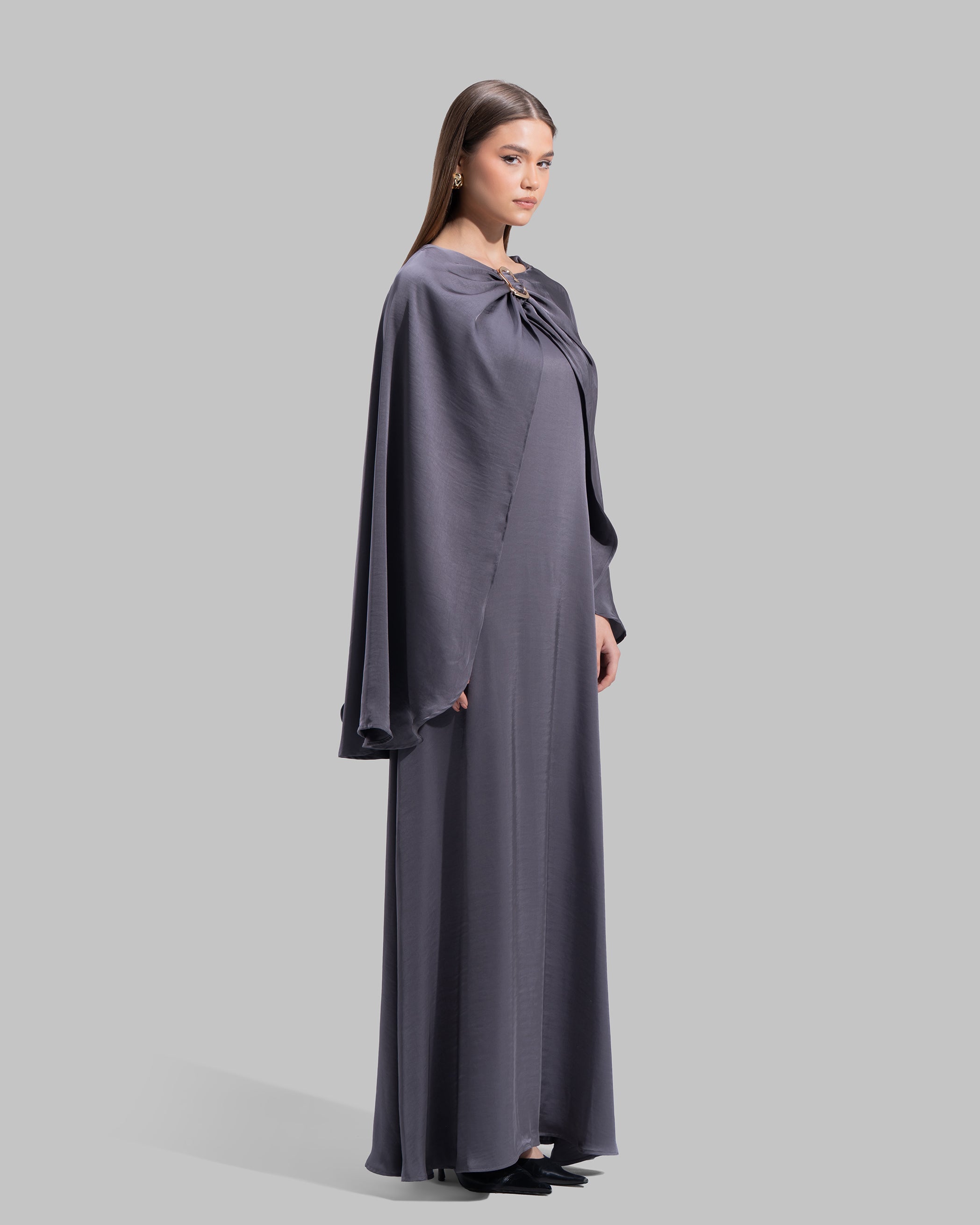 Long dress made of a flowing satin-finish fabric.