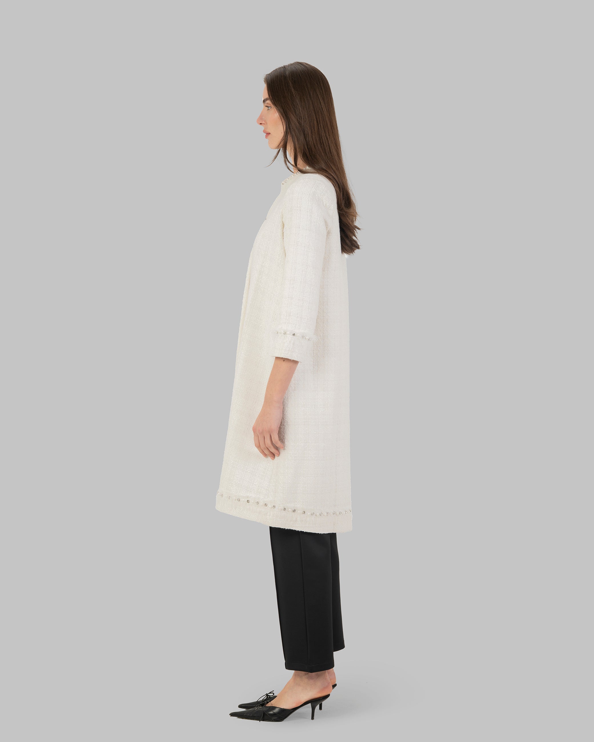 Long, off white coat made of textured tweed fabric