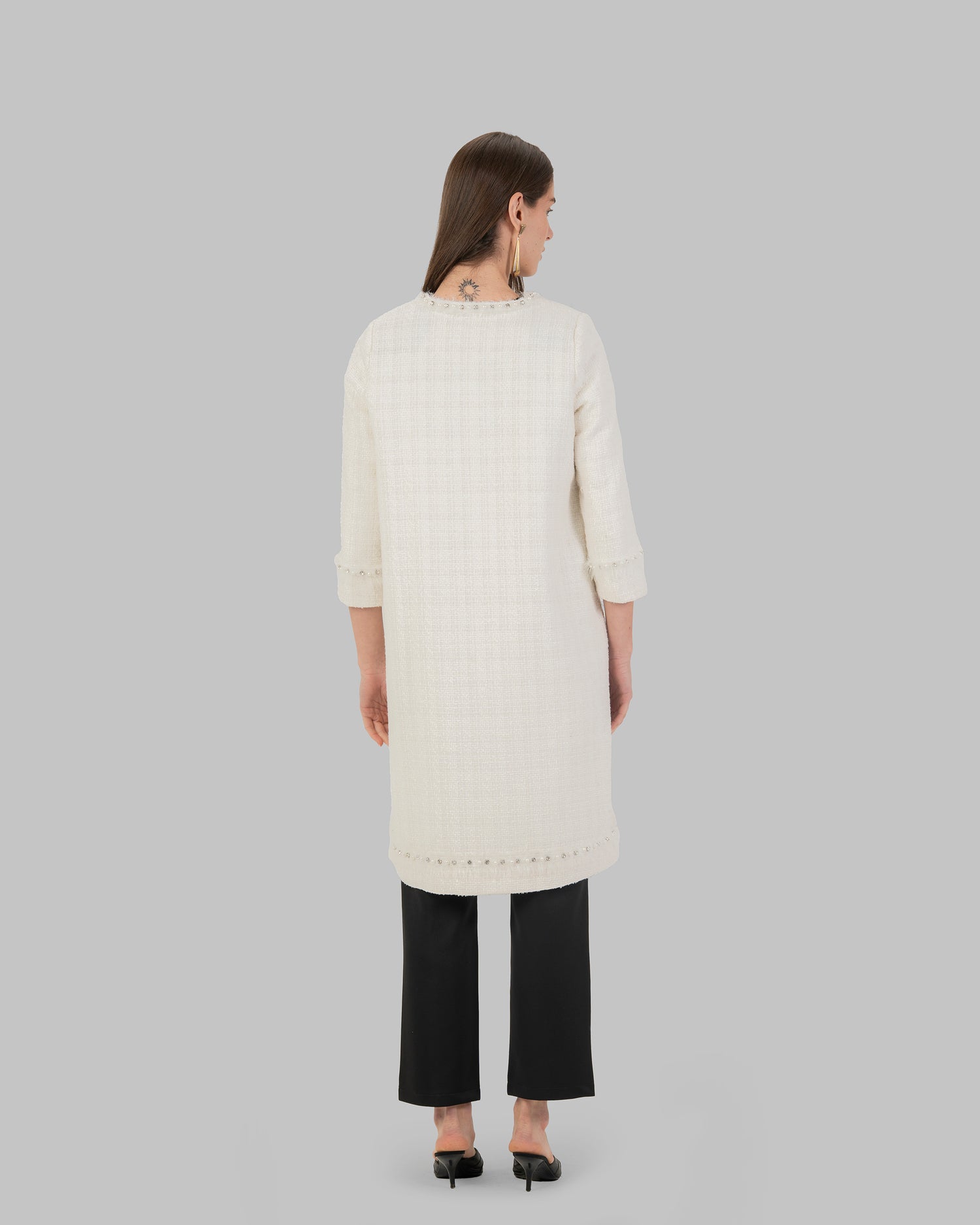 Long, off white coat made of textured tweed fabric