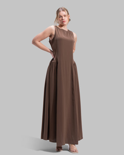 Sleeveless long dress with a round neckline.