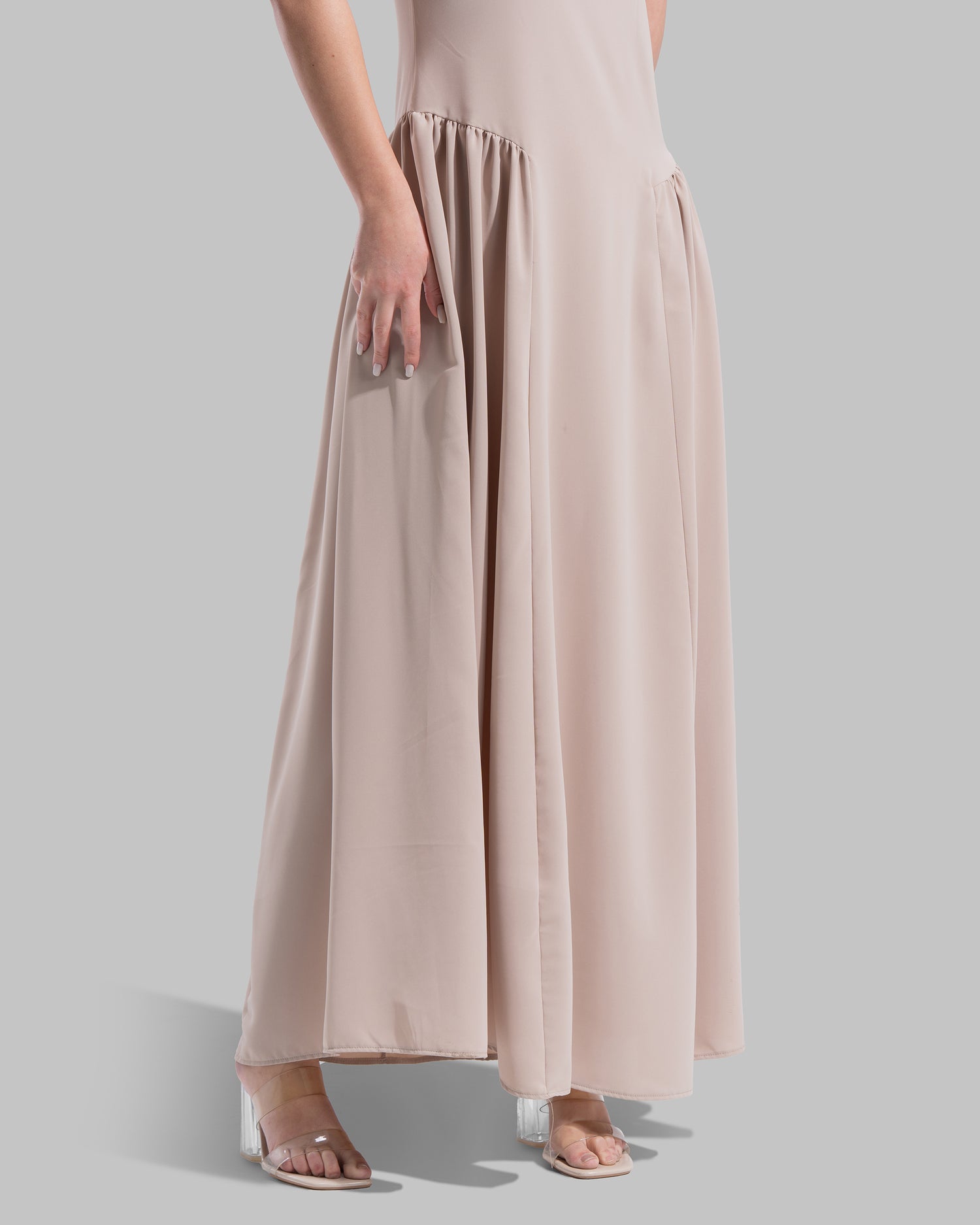 Sleeveless long dress with a round neckline.