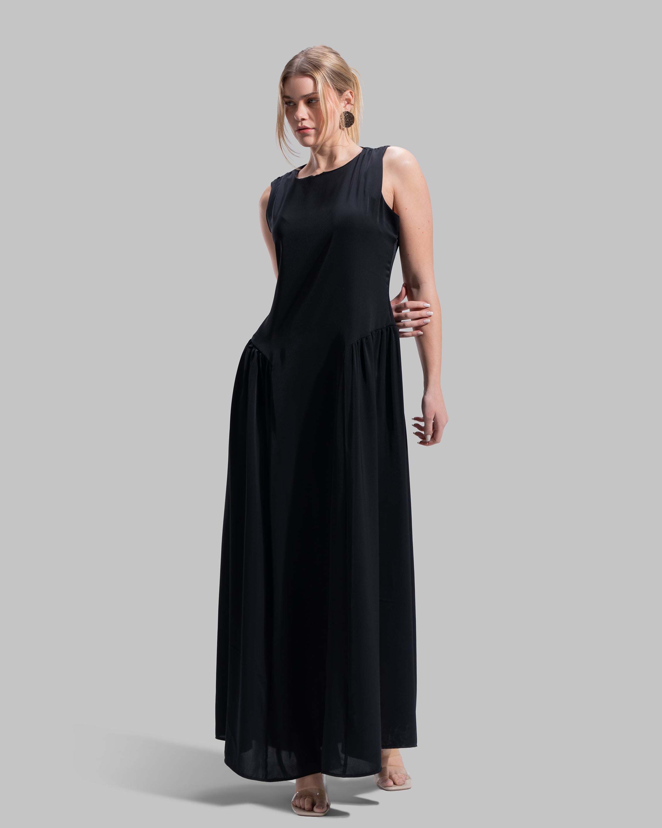 Sleeveless long dress with a round neckline.