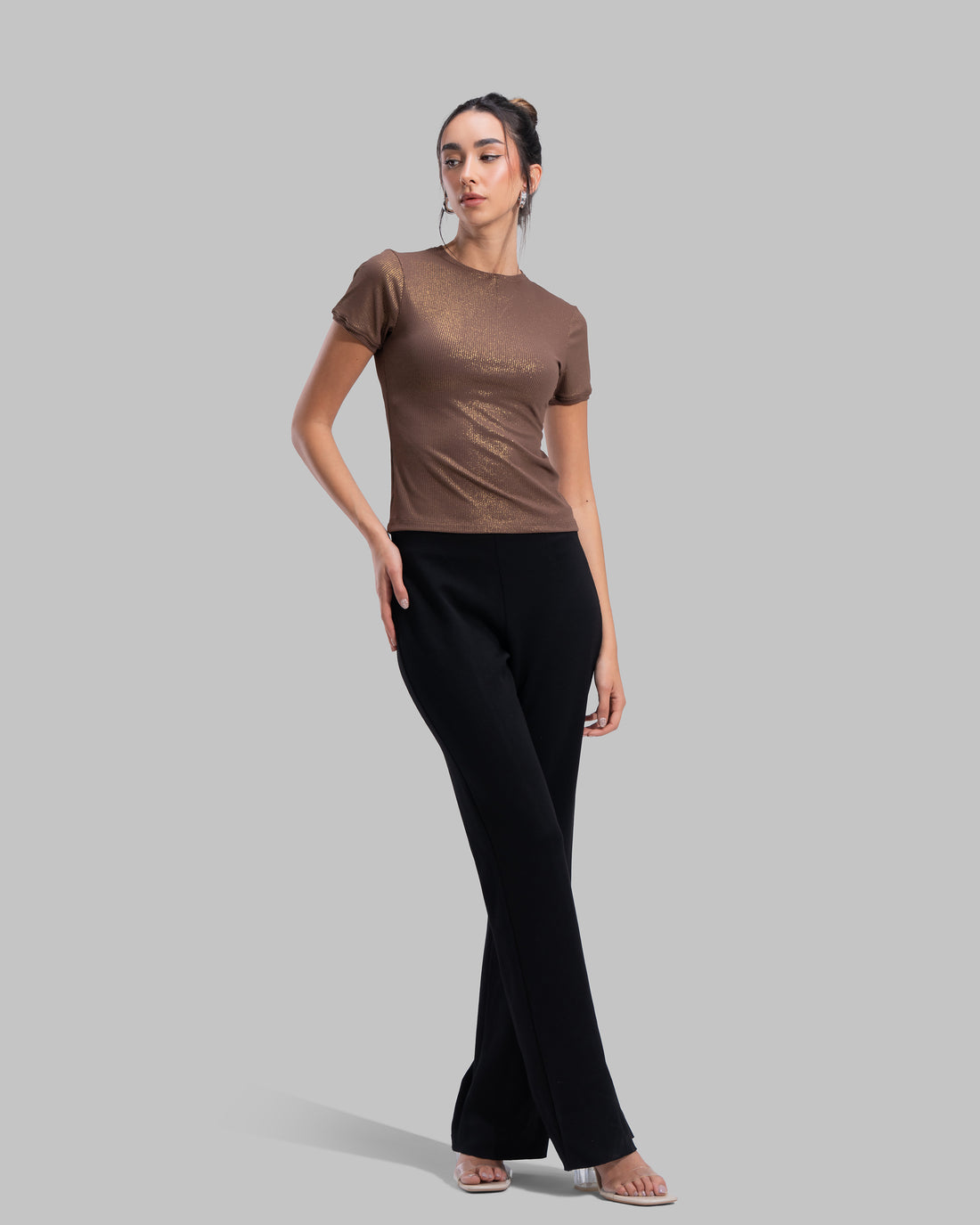 Short sleeve ribbed top with a shimmering metallic finish and round neck.