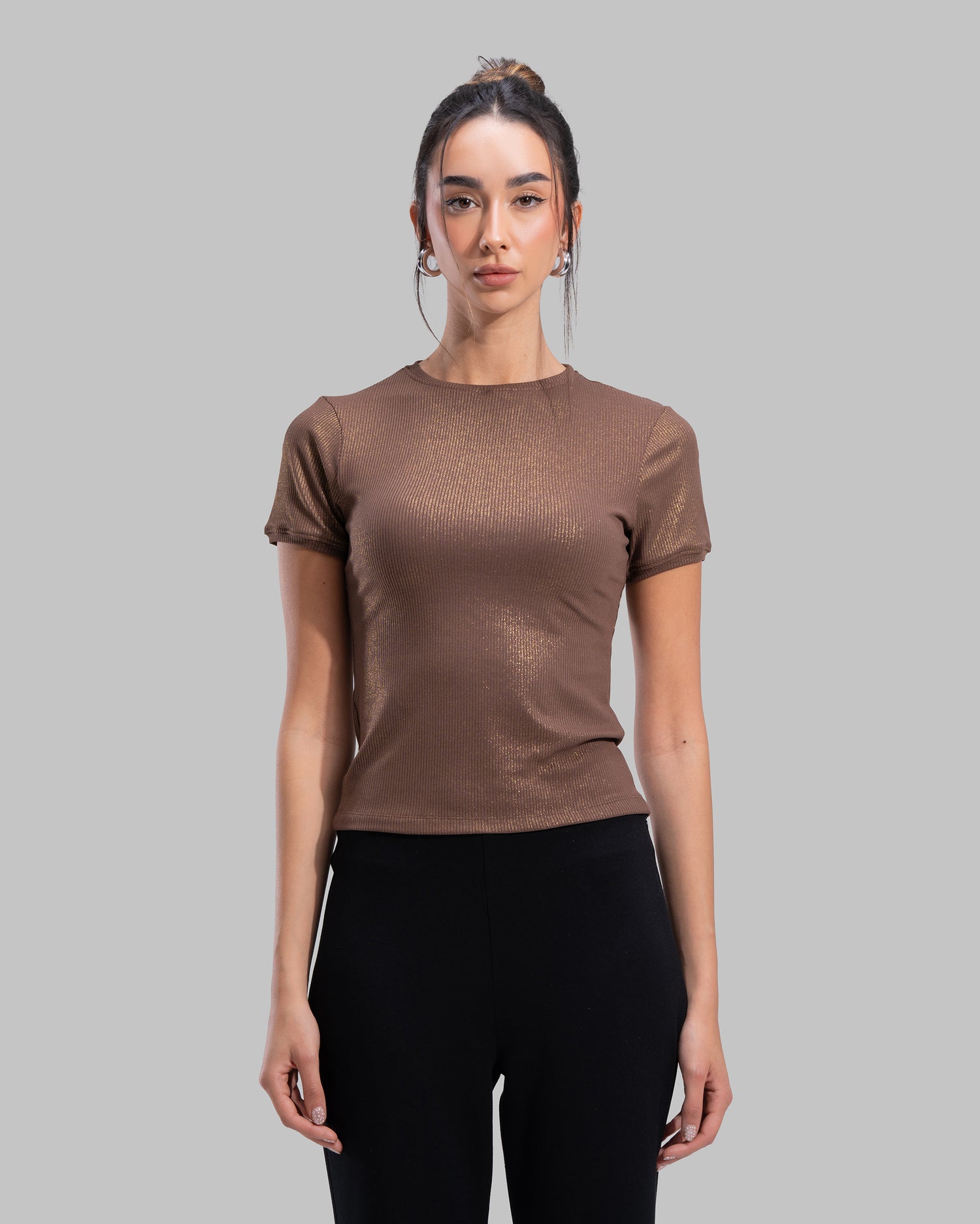 Short sleeve ribbed top with a shimmering metallic finish and round neck.