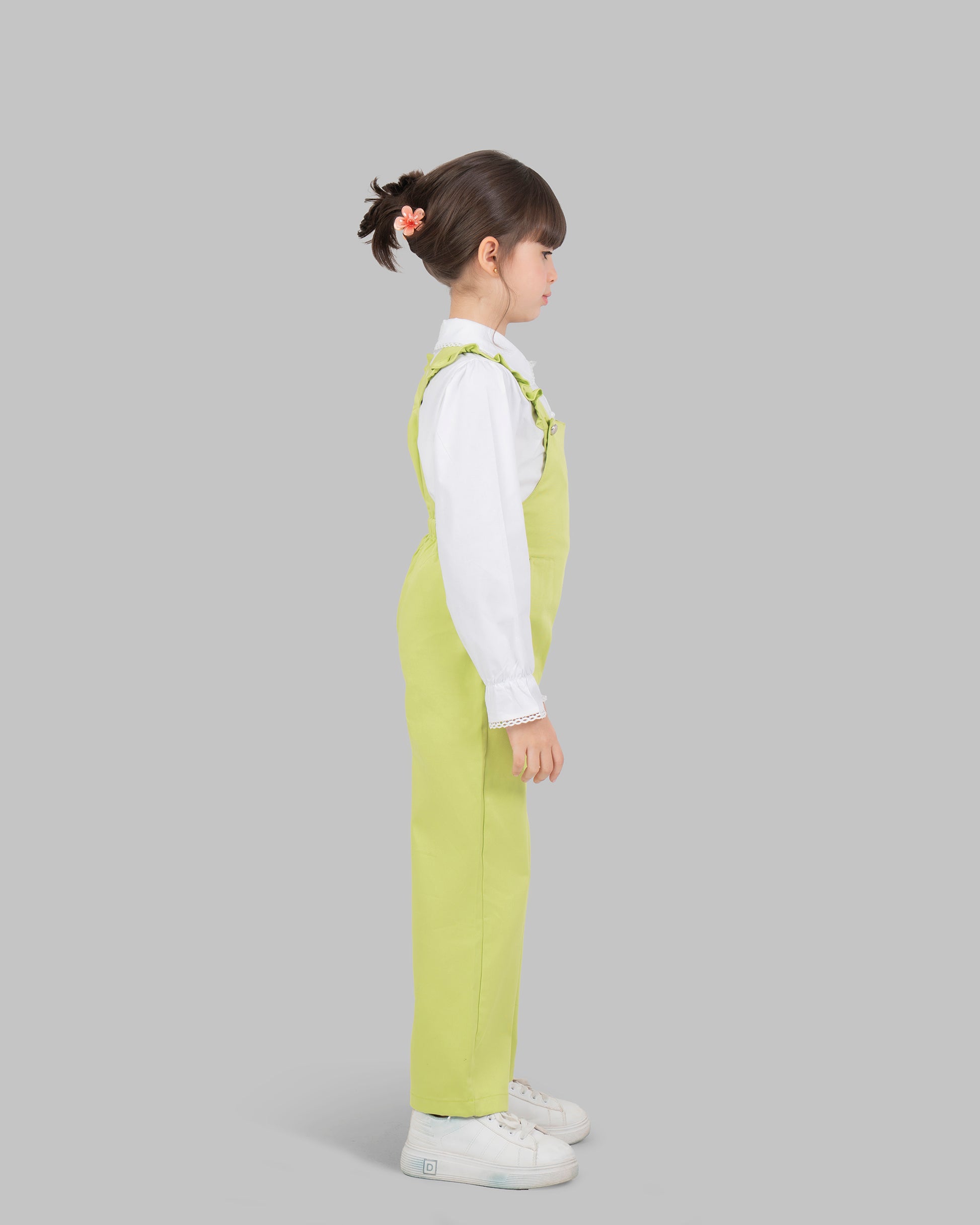 jumpsuit in flashy colors with adjustable shoulder straps and ruffle detailing.