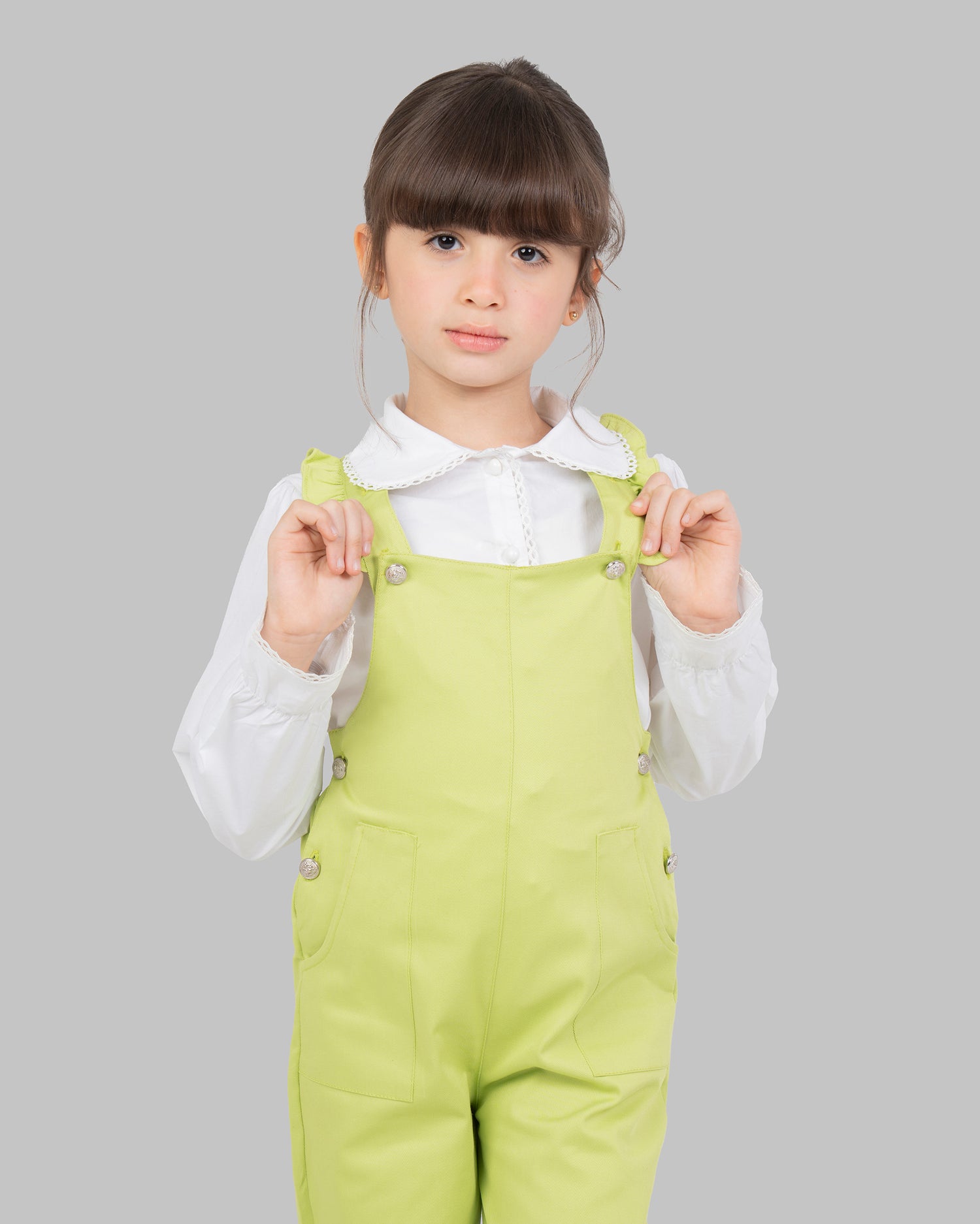 jumpsuit in flashy colors with adjustable shoulder straps and ruffle detailing.
