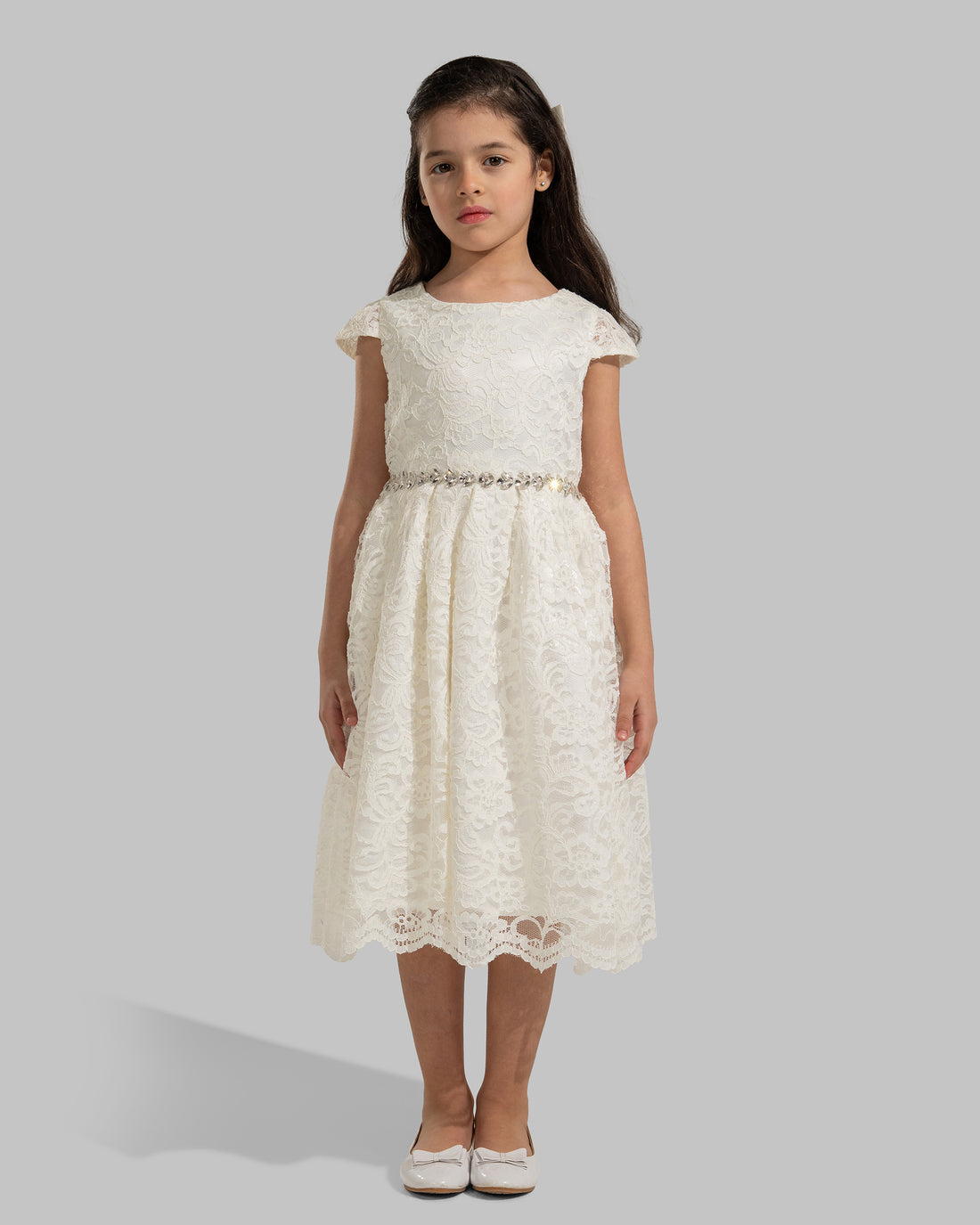 An elegant white floral lace dress featuring short capped sleeves