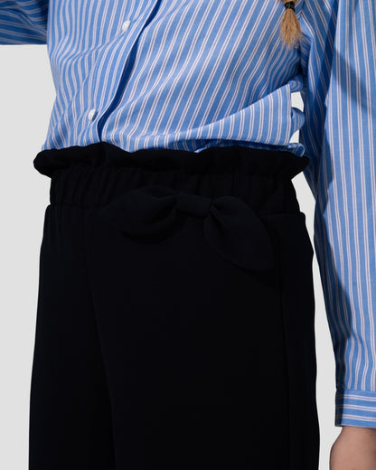 Wide-leg culotte trousers in navy blue with a high waist and side tie detail.
