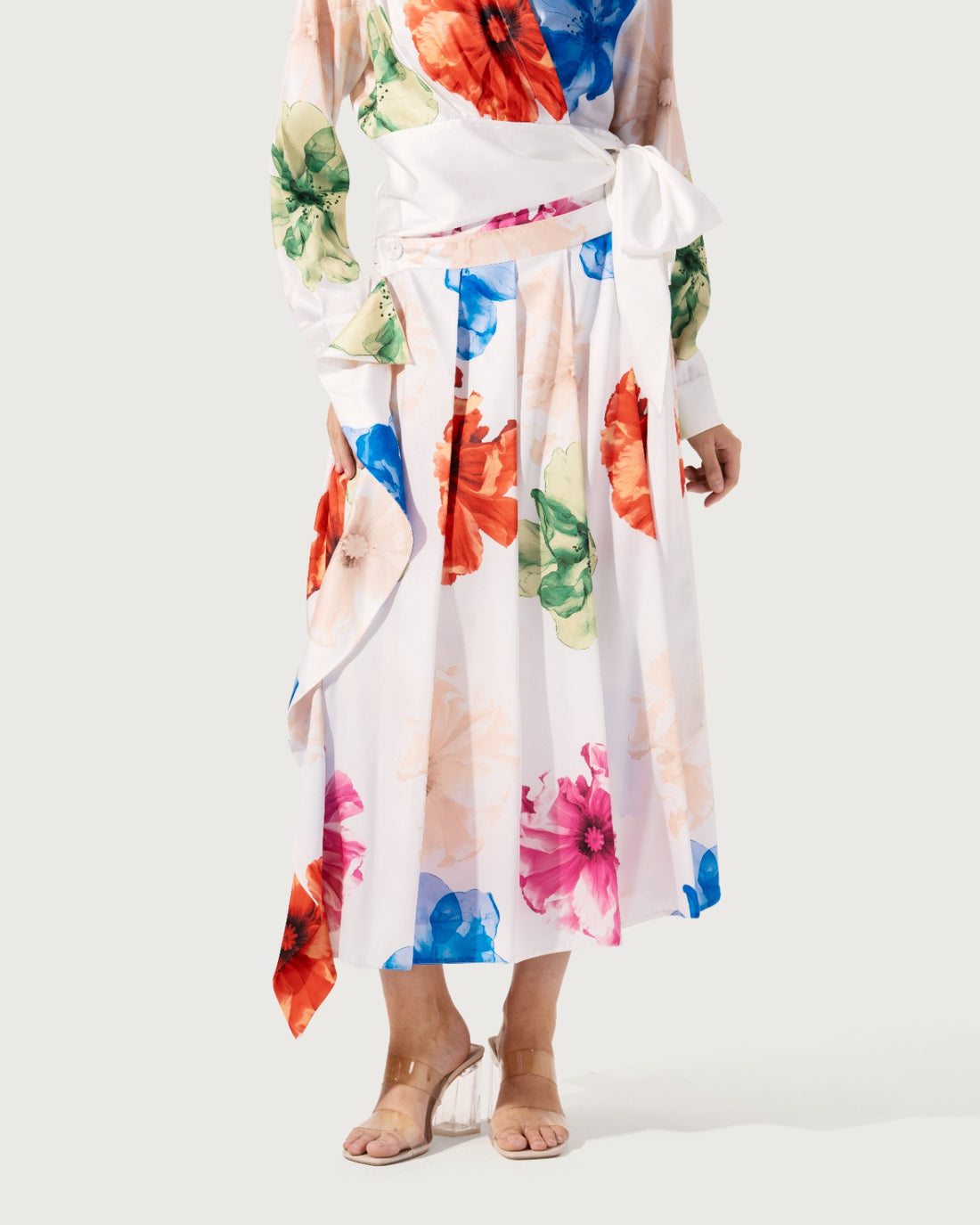 Pleated midi skirt crafted , featuring an all-over watercolor floral print